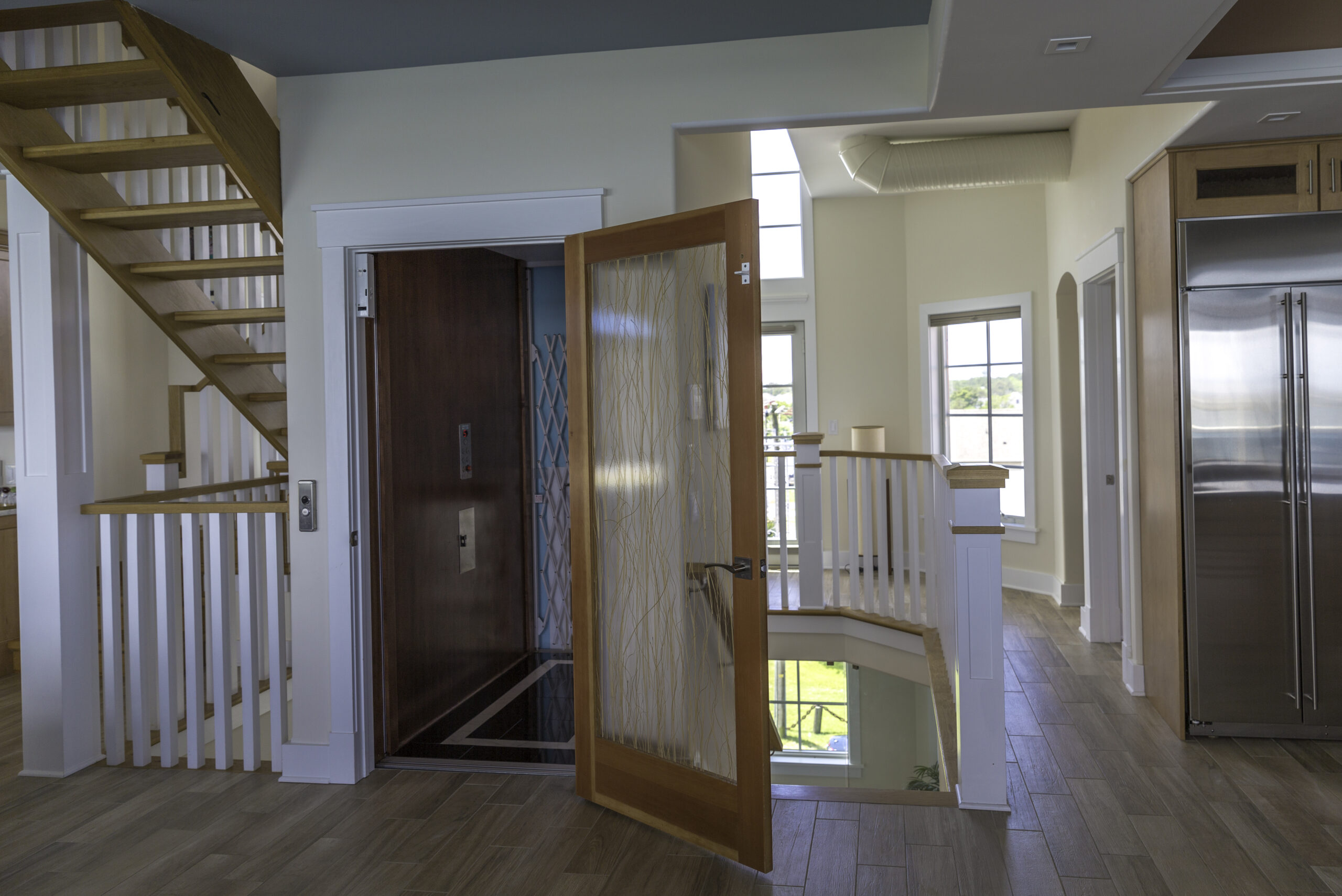 Interior home elevator next to stairs