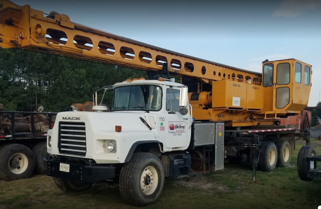 a large truck with a crane on the back of it