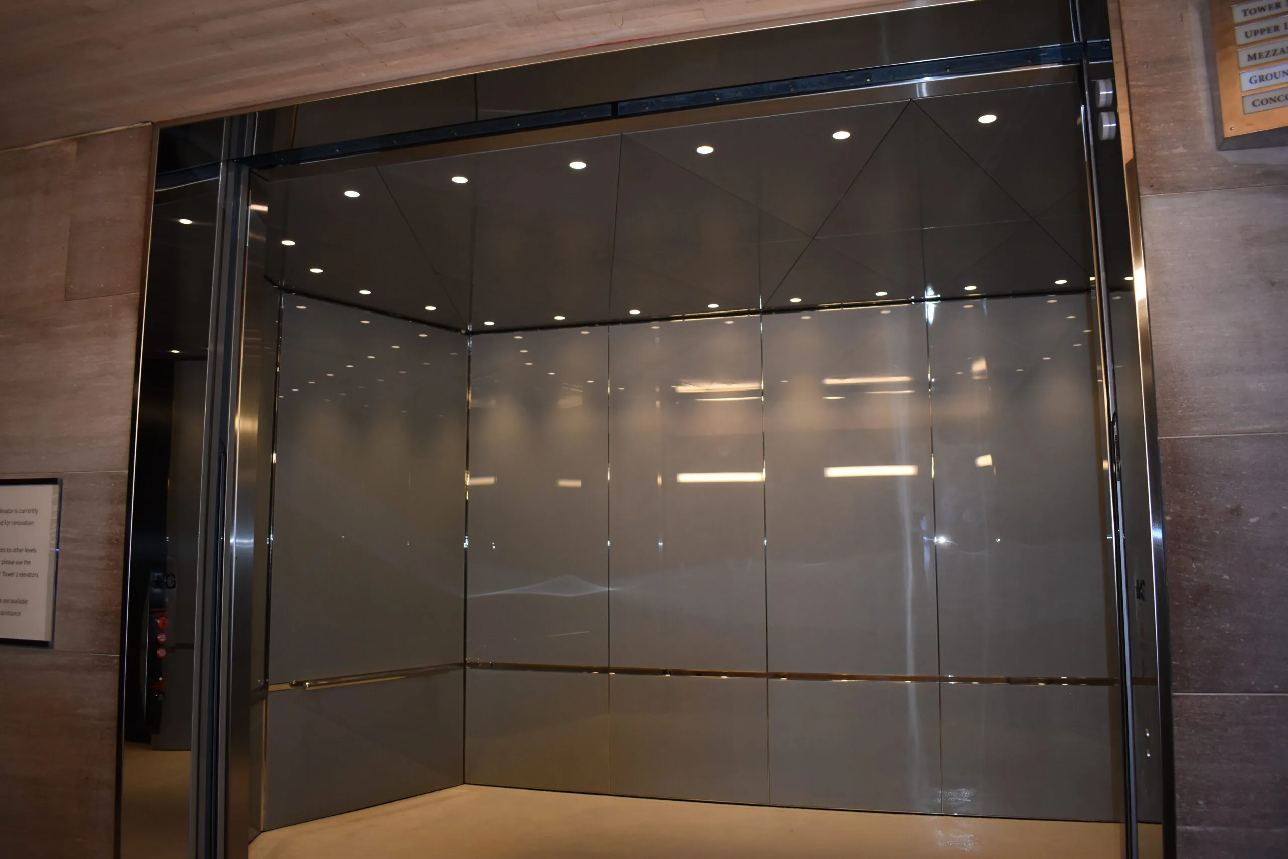 a glass walled shower stall in a bathroom
