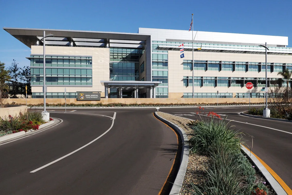 a large building sitting on the side of a road