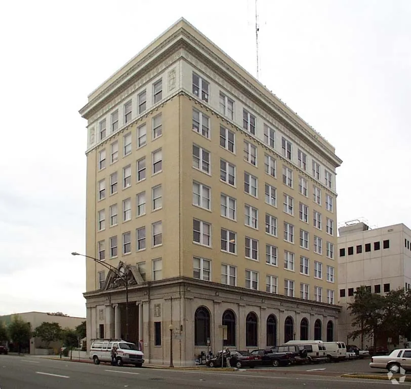 a tall building sitting on the corner of a street