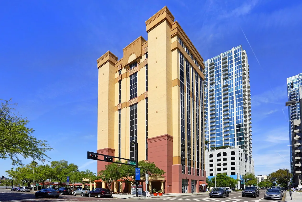 a tall building sitting on the corner of a street