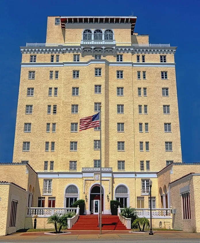 a tall building with a flag on top of it