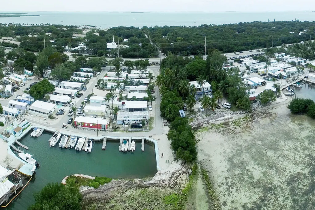 an aerial view of a marina with many boats
